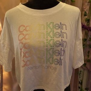 large and lose fitting, multi colored words but plain white shirt, very cute!